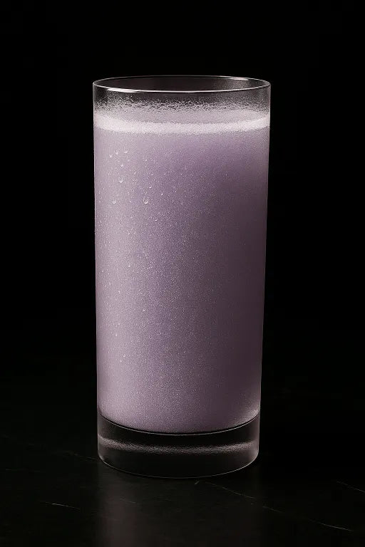 Purple Powder in a clear glass on a black background